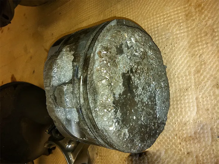 An aircraft piston showing damage that occurred in just minutes as a result of detonation and overheating